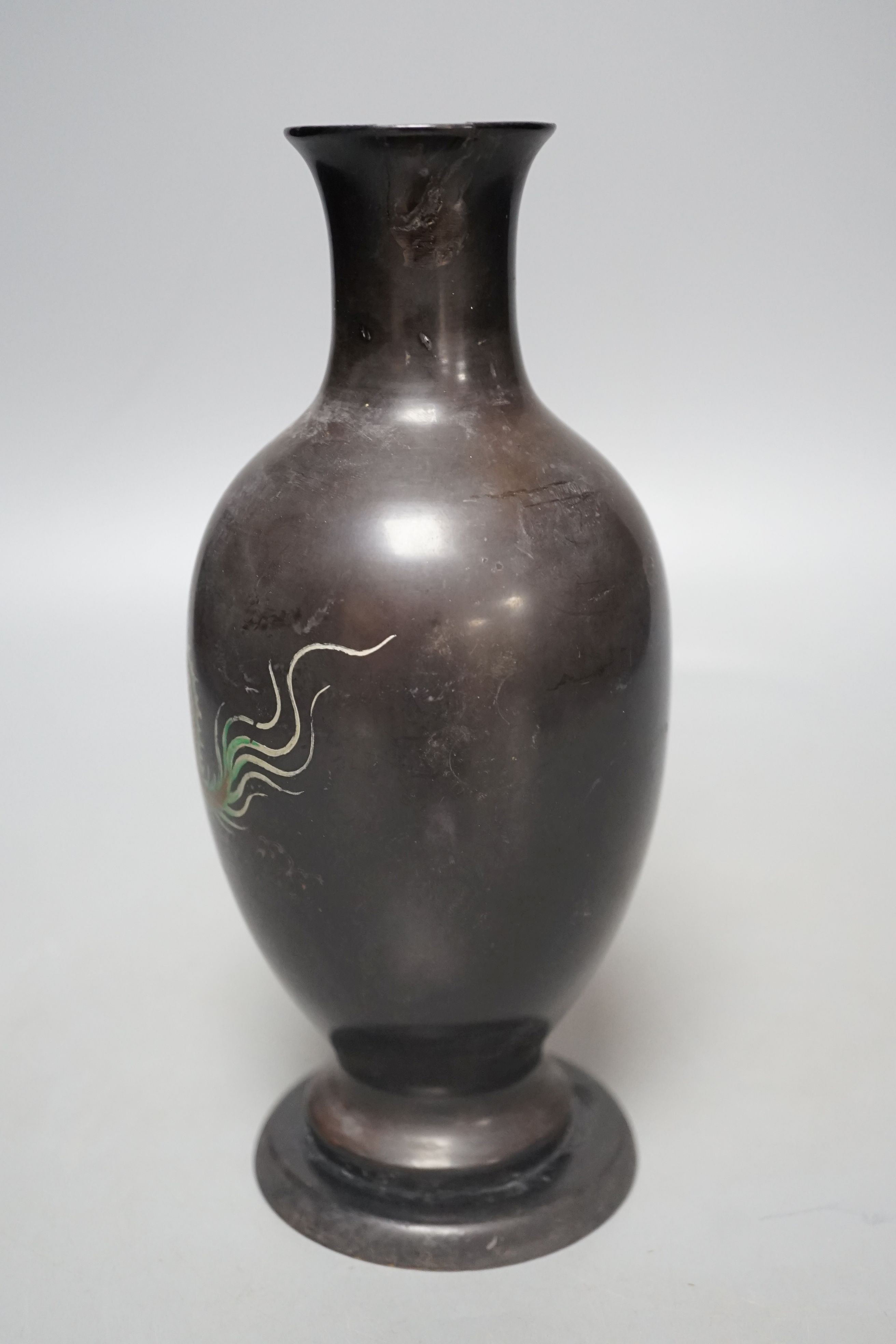 A Chinese Fuzhou lacquer papier-mâché dragon design vase, 20.5 cms high.